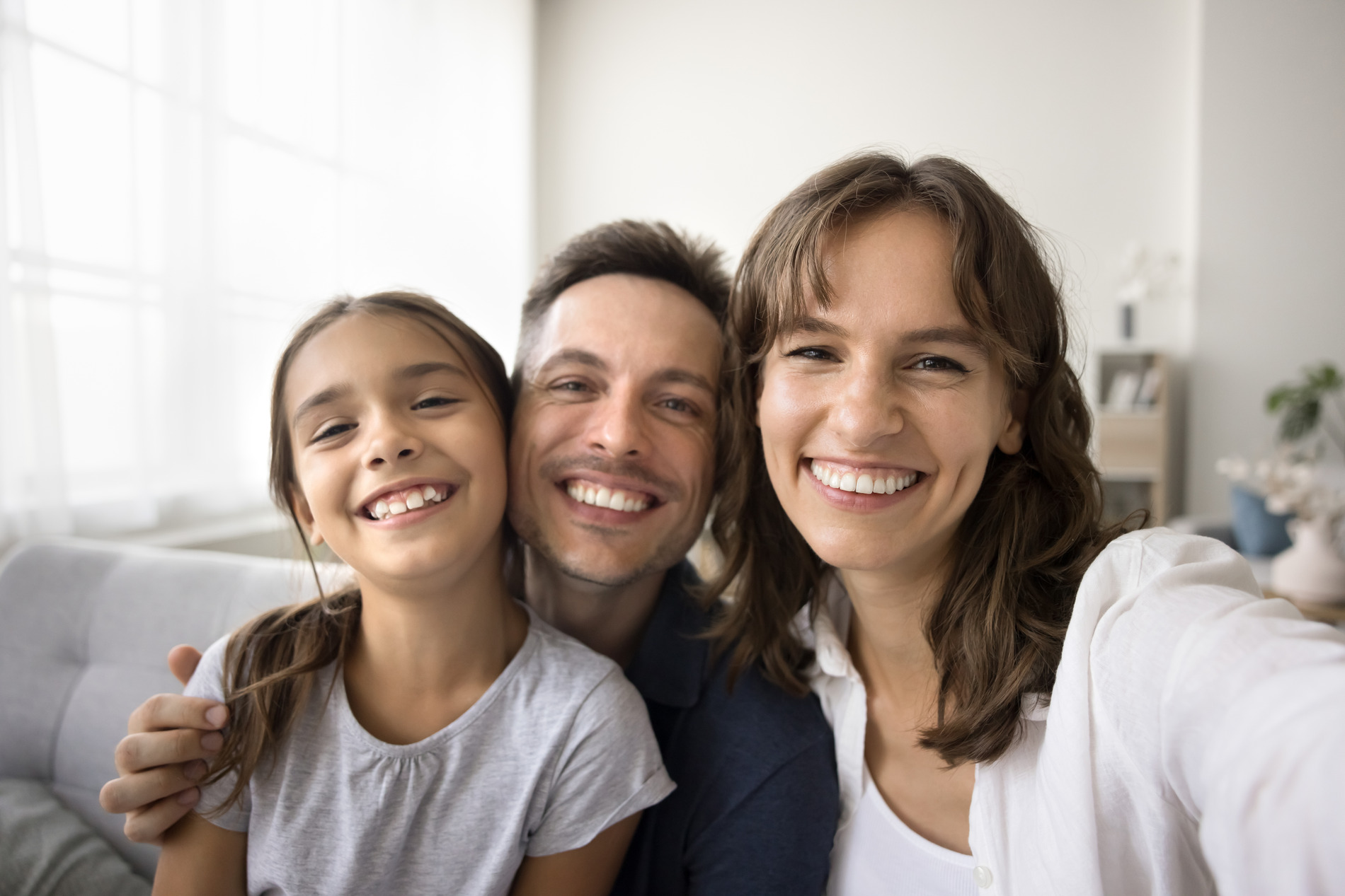 AdobeStock_712760597 v2 Family smiling on their way to Rechtin Jacobs Orthodontics for Invisalign