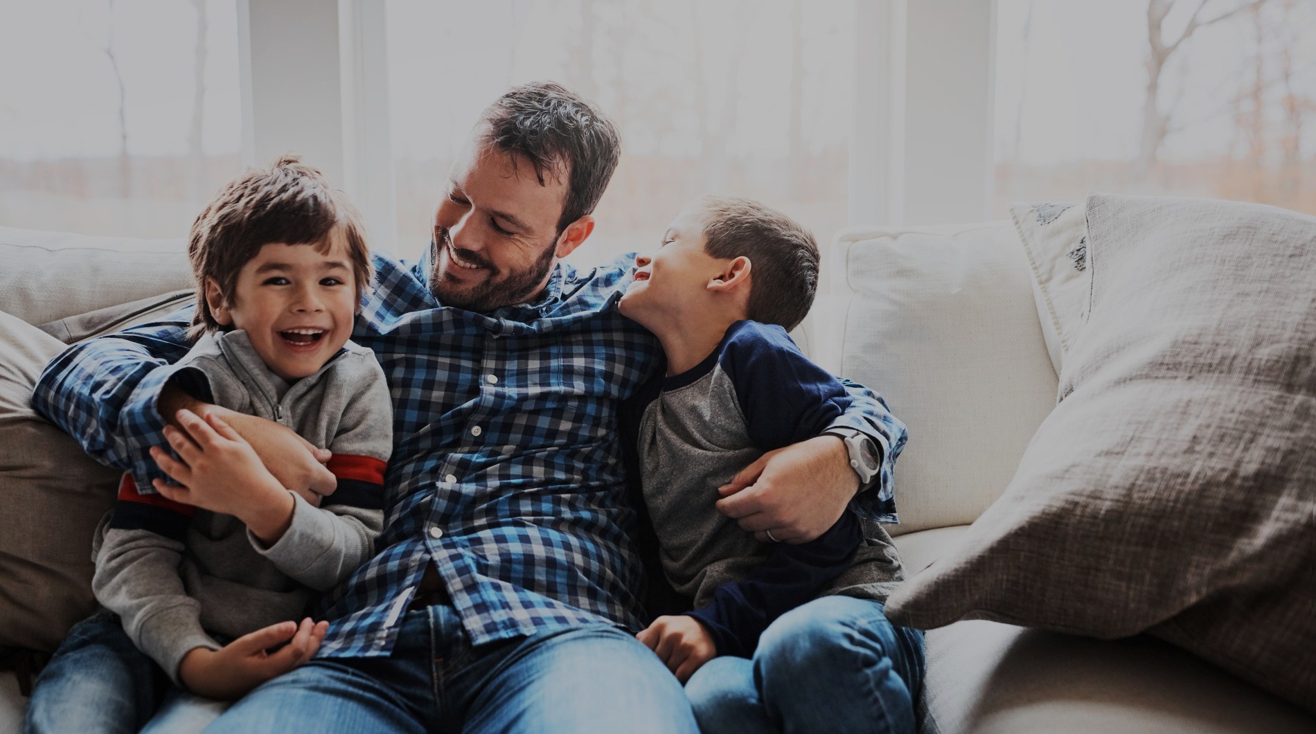 AdobeStock_562962796 v5 Family laughing together excited about straighter teeth with Invisalign First