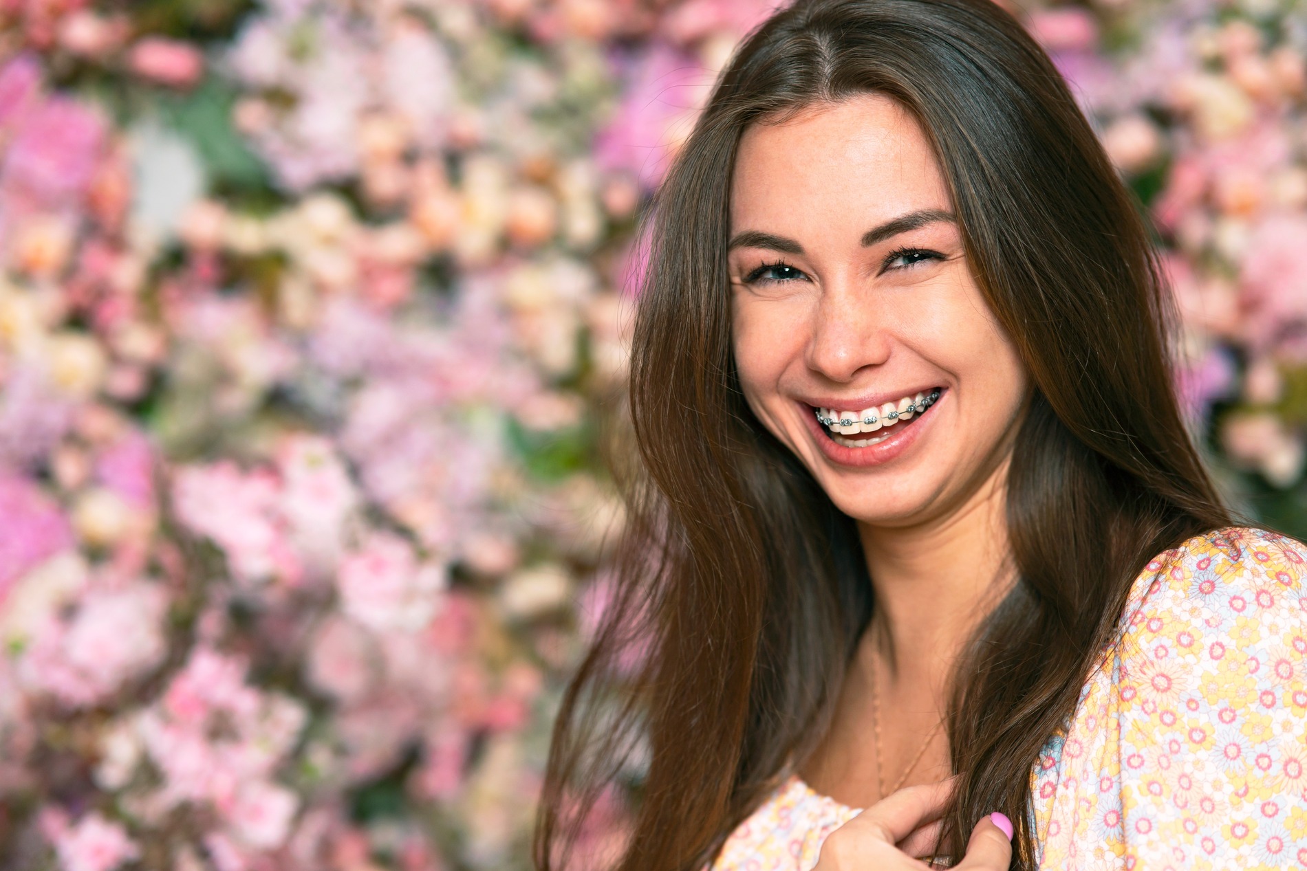 Woman with braces smile after othodontic treatment in KEntucky