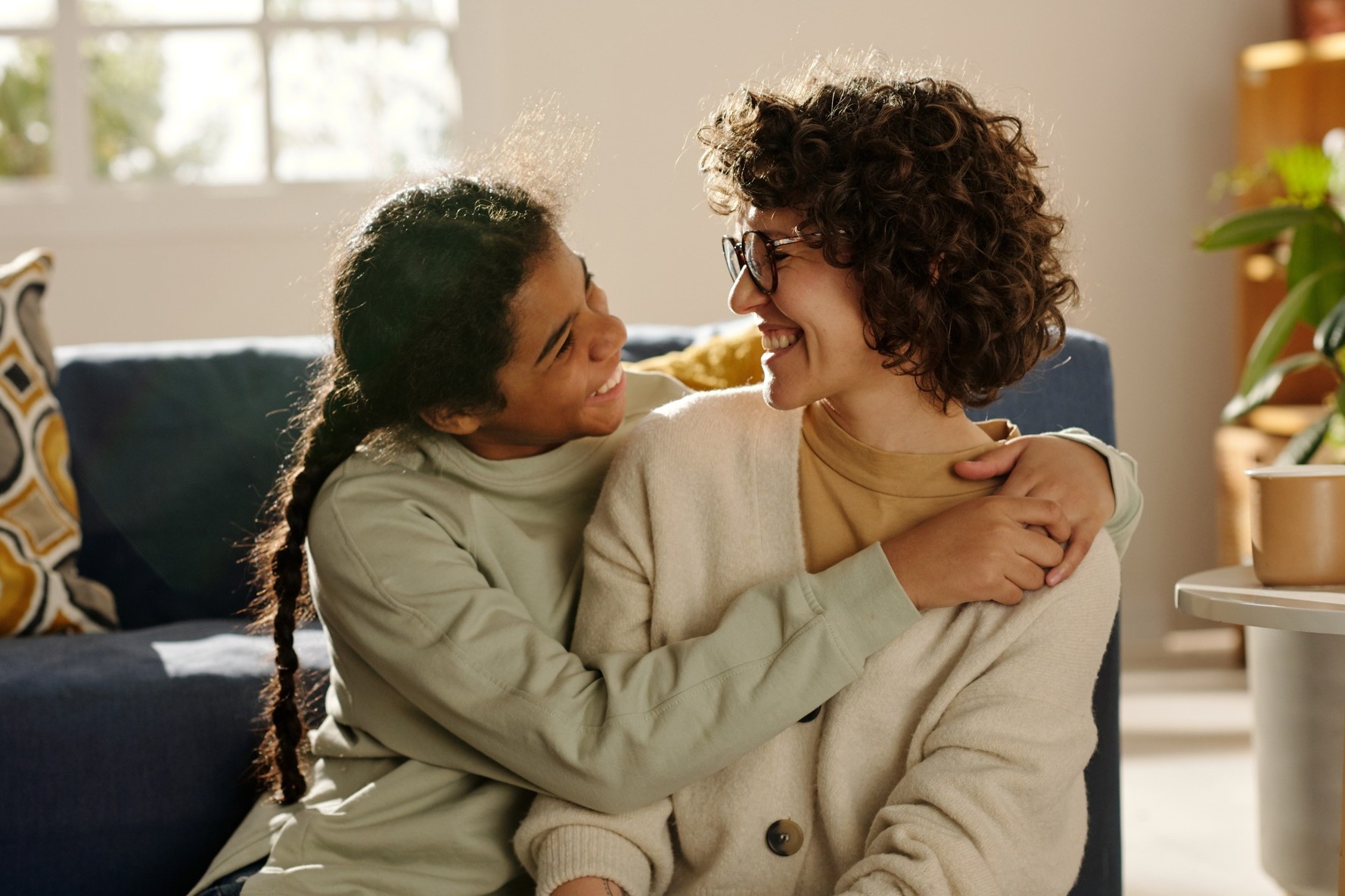 Mom and daughter laugh together because they have straight teeth from miniscrew assisted rapid palatal expansion in Crestview Hills KY