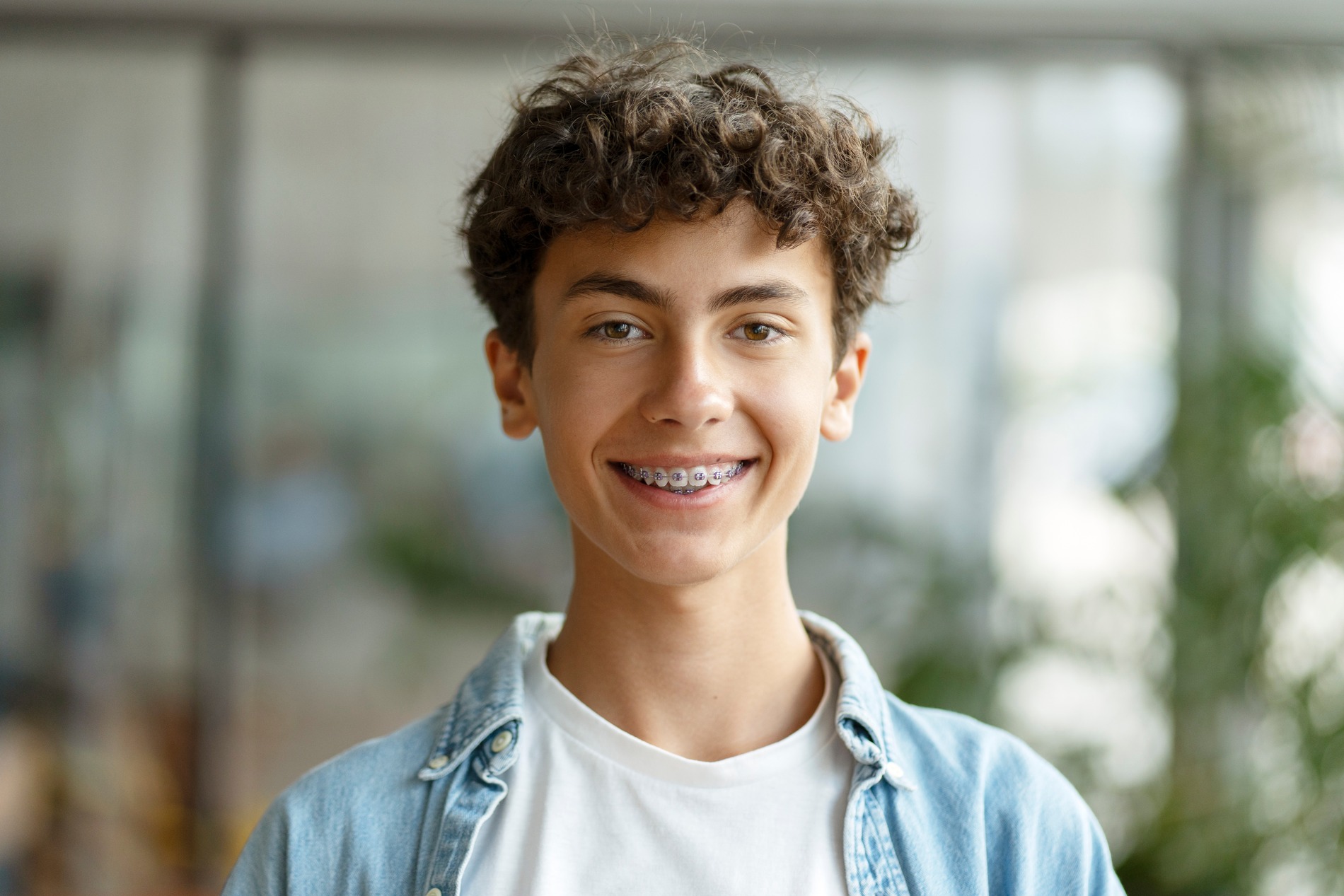 Boy with braces talks about marpe treatment with Dr. Rechtin