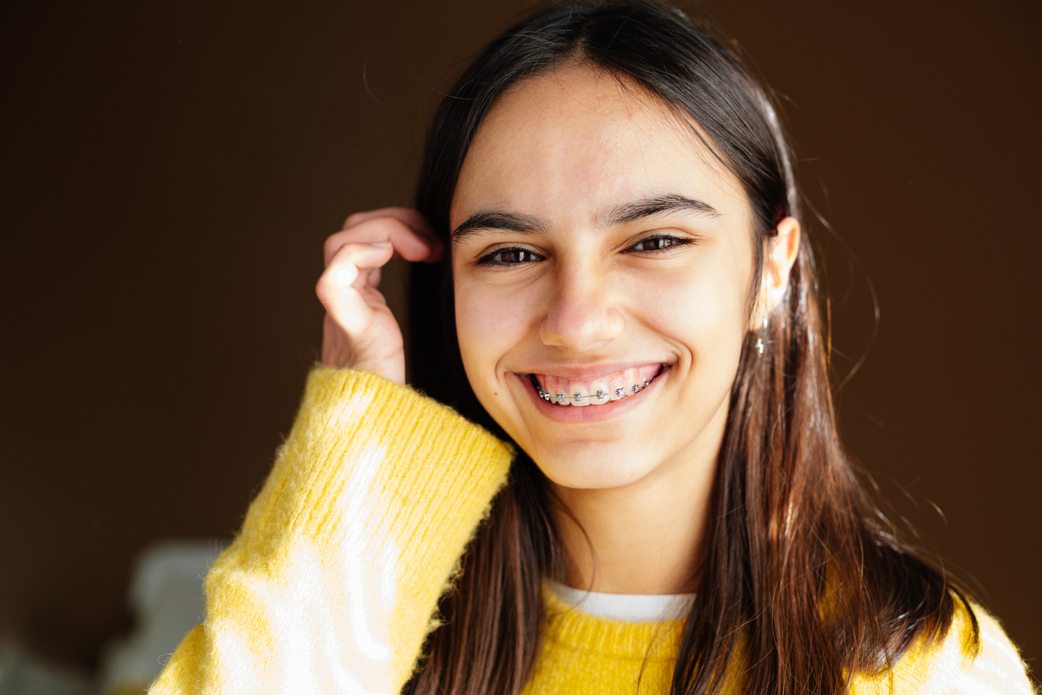 Girl with braces discussing whether Limited or Comprehensive Orthodontic Treatment is best for her in Crestview Hills
