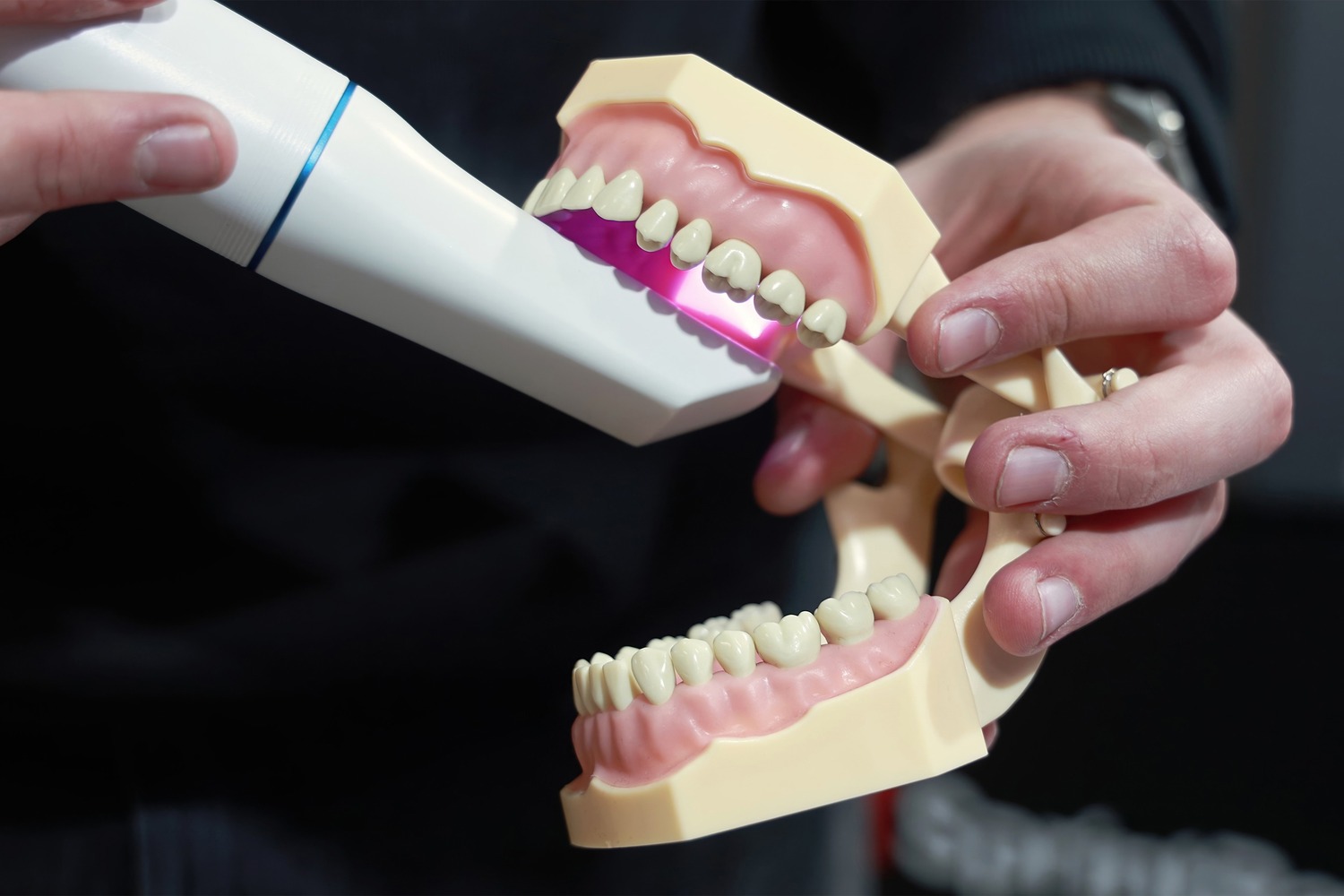 Orthodontist models the 3d imaging technology used at Rechtin Jacobs Orthodontics in Crestview Hills KY
